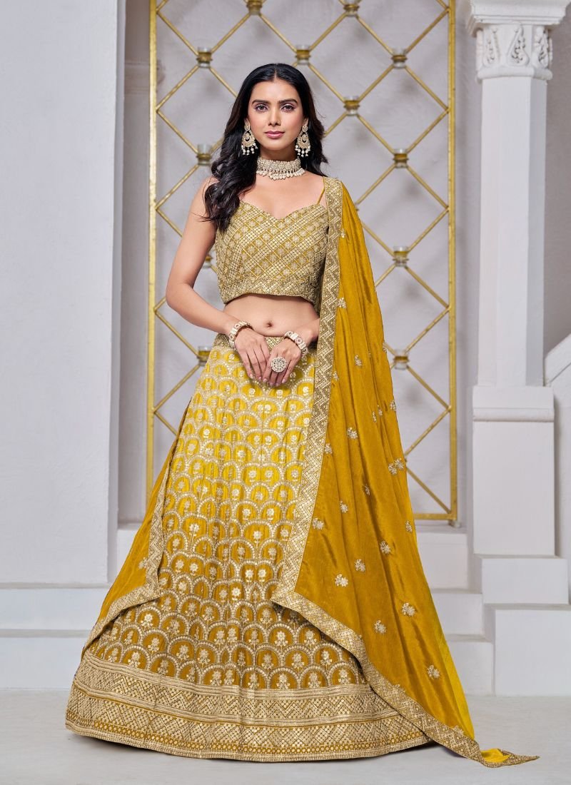 Exquisite heavy embroidered chinon lehenga in yellow