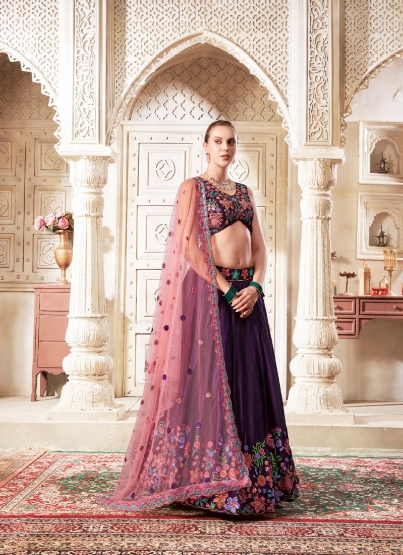 Designer embroidered flared net lehenga in wine