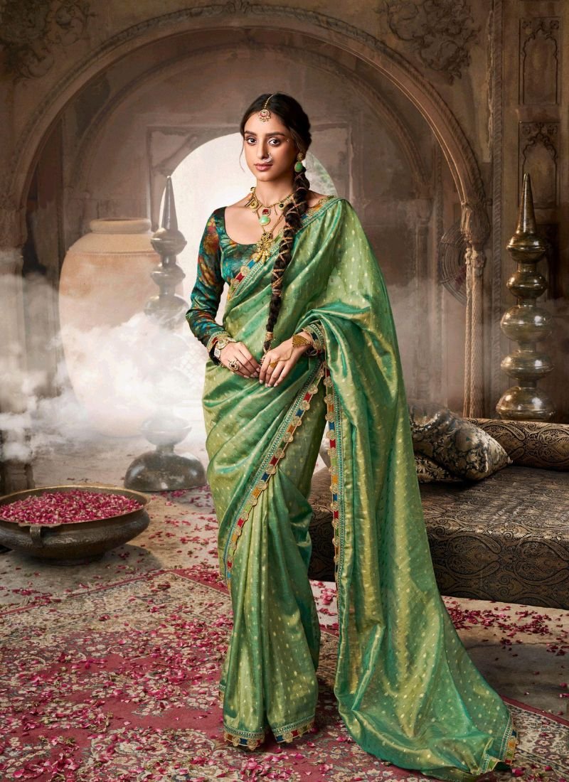 Elegant hand woven tissue silk saree in dark green