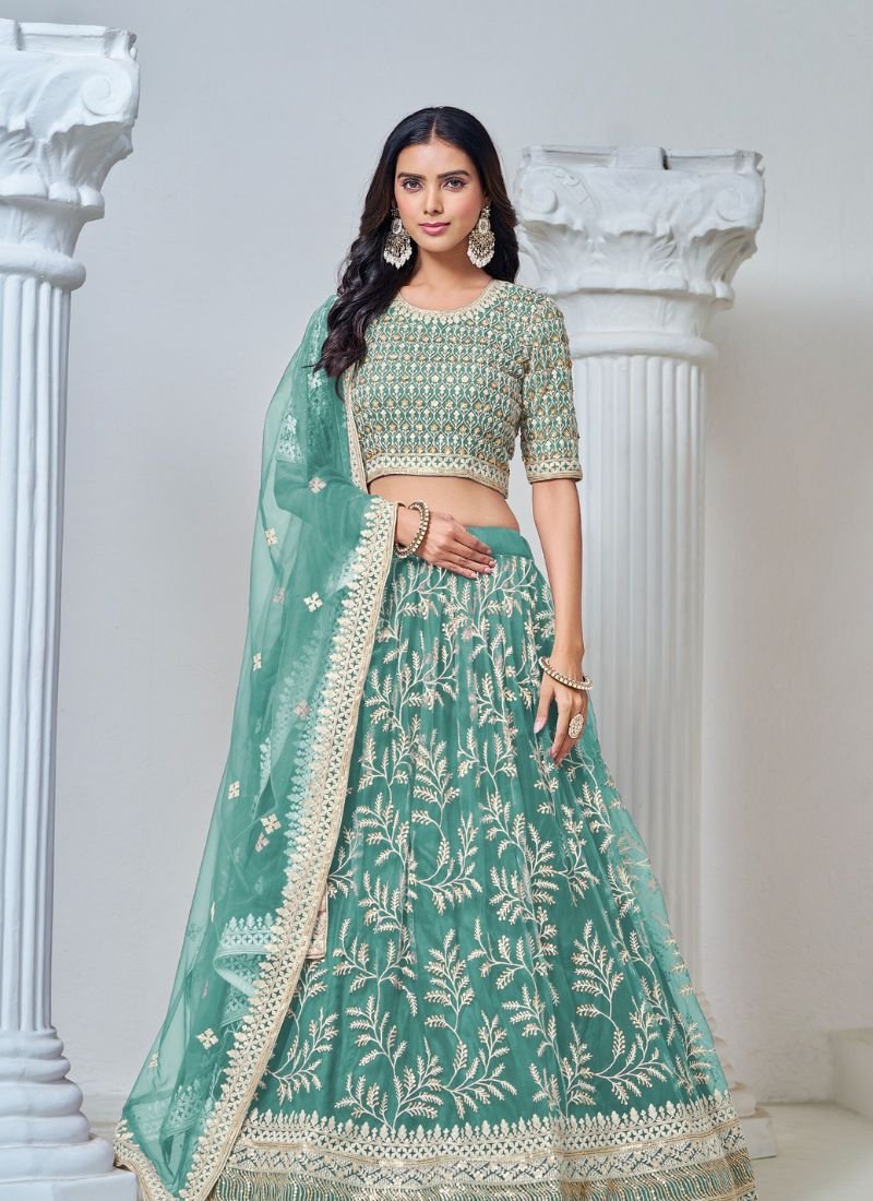 Exquisite heavy thread embroidered net lehenga choli in green