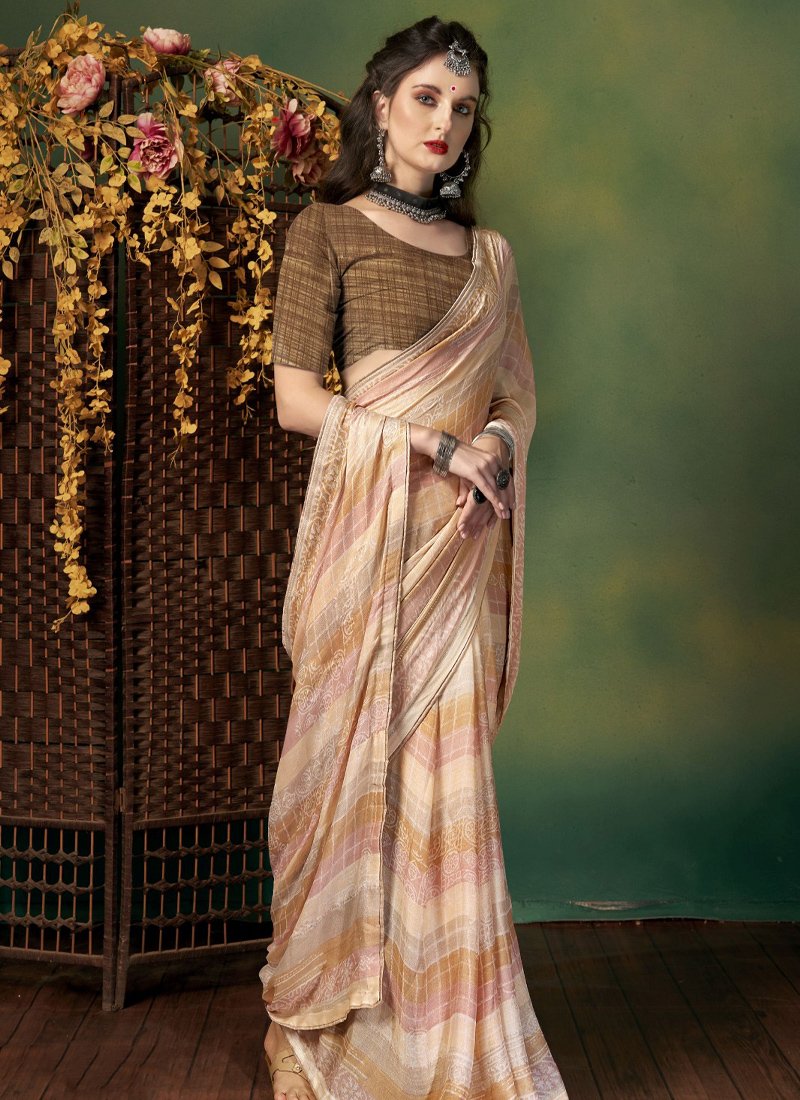 Elegant pattern worked georgette saree in light brown