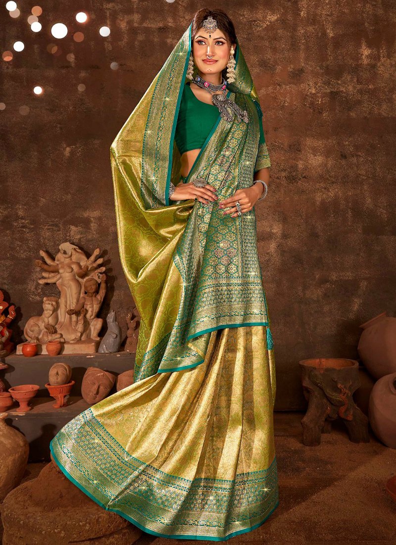 Exquisite jarkan worked soft tissue silk saree in dark green