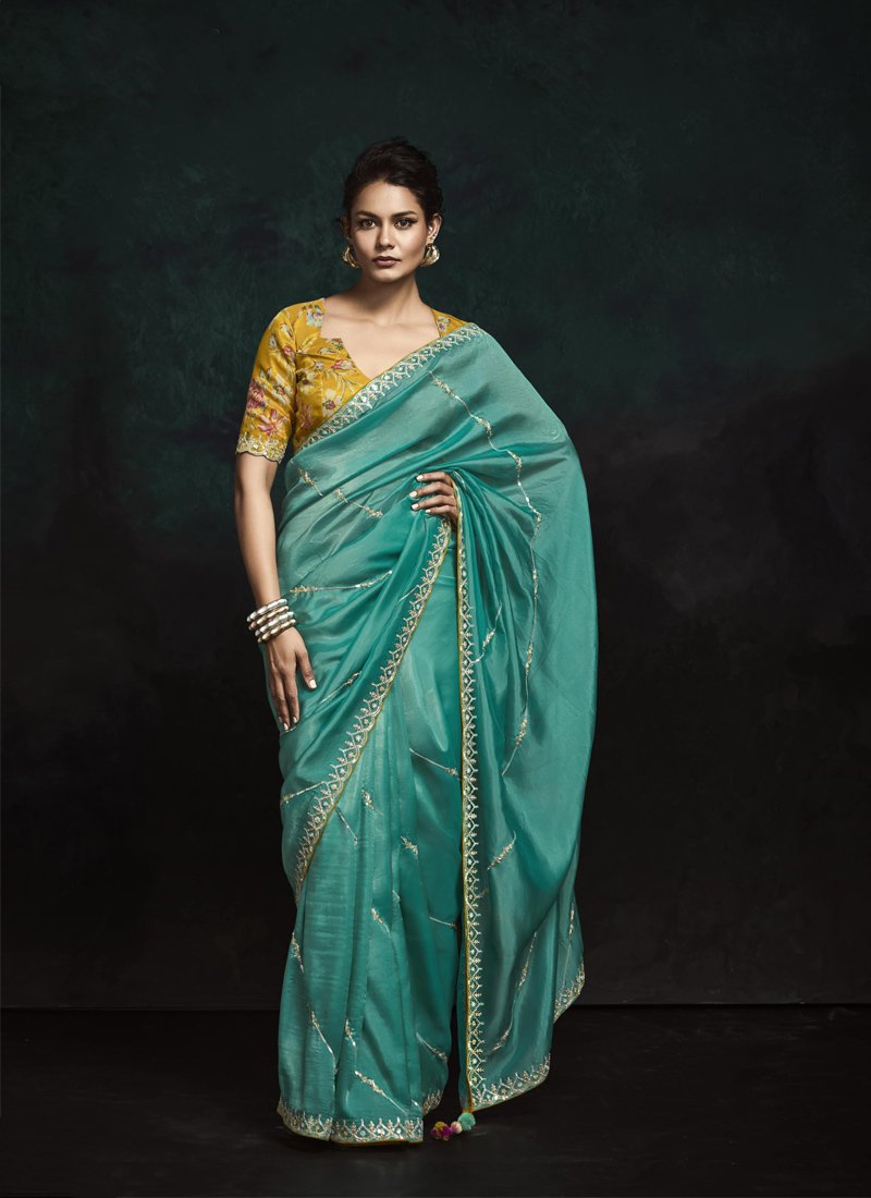 Exquisite Tissue Silk Saree with Embroidered Border and Tassels in blue